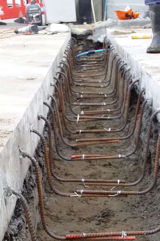 Rebar is tied to form stirrups. The bottom of the stirrups need to be about half the distance between the bottom of the channel and the trench bottom. 100mm Width, 50mm from the bottom of the channel & 200mm width, 75mm from the bottom of the channel
 